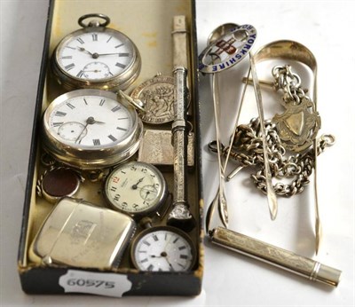 Lot 224 - A collection of assorted silver including an Albert chain, sugar tongs, pocket watches, vesta...
