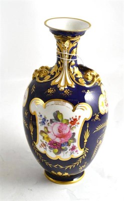 Lot 236 - Royal Crown Derby floral decorated vase on a blue and gilt ground