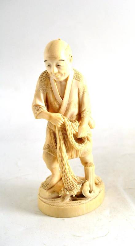 Lot 237 - A Japanese ivory figure of a fisherman