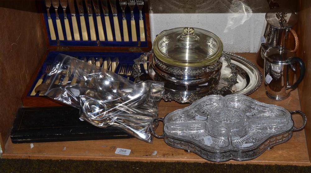 Lot 268 - Plated ware comprising; bread dish, oval meat dish, two hot water jugs, quantity of flatware, glass