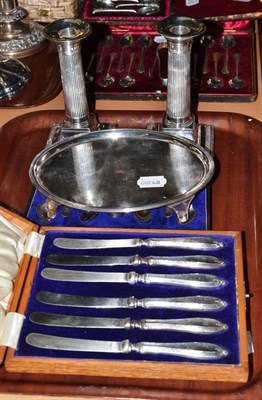 Lot 276 - Pair of silver table candlesticks, oval plated teapot stand, cased silver teaspoons and tea knives
