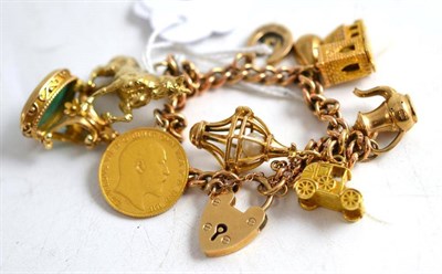 Lot 310 - Gold charm bracelet