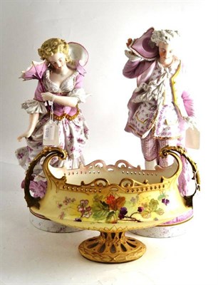 Lot 324 - A pair of French porcelain figures and an Austrian blush ivory centrepiece