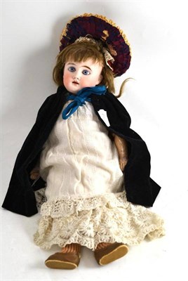 Lot 329 - A French porcelain doll with bonnet and dress