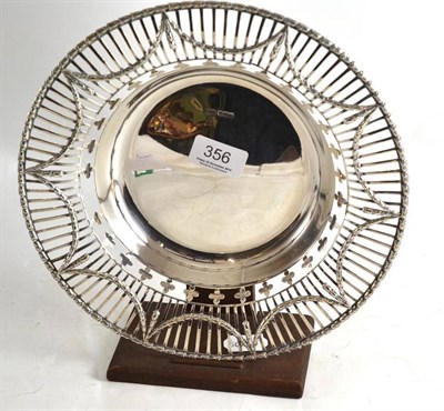 Lot 356 - A pierced silver bowl on wooden stand