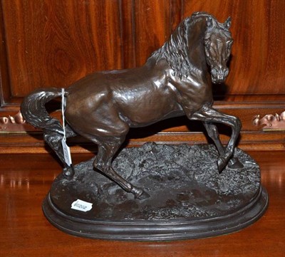 Lot 371 - A bronzed resin figure of a horse