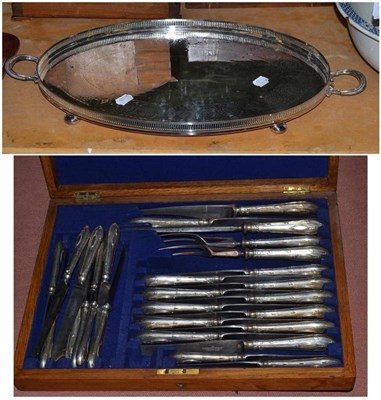 Lot 372 - A set of cased steel knives and a twin handled plated tray (2)