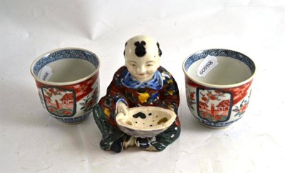 Lot 389 - Pair of Imari beakers and a Japanese figure of a boy