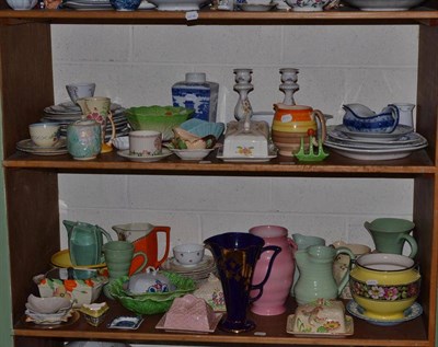 Lot 402 - Two shelves of 1930s pottery including jardinieres, jugs, leaf moulded dishes etc