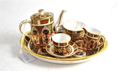 Lot 426 - Royal Crown Derby miniature four piece tea service in Imari pattern no. 1128 and a matching...