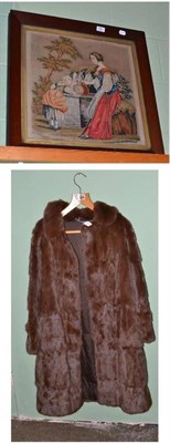 Lot 506 - Victorian mahogany framed woolwork picture of a lady and child and a brown fur jacket