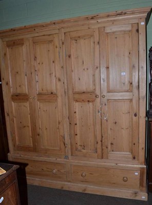 Lot 529 - A large pine double wardrobe