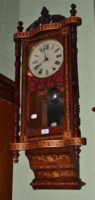 Lot 533 - A walnut cased Vienna type wall clock