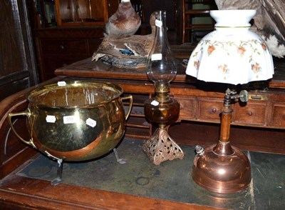 Lot 553 - Brass two handled cauldron on tripod feet, glass well oil lamp and 'The Evening Star' copper...