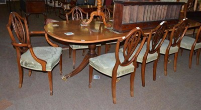 Lot 557 - Dining room suite comprising: ten foot table, ten chairs and a sideboard