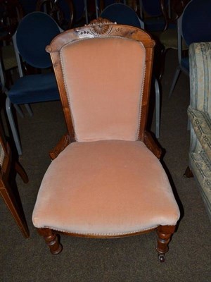 Lot 585 - A Victorian walnut framed nursing chair