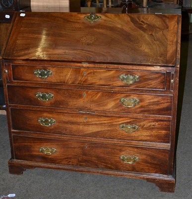 Lot 593 - A Georgian mahogany bureau