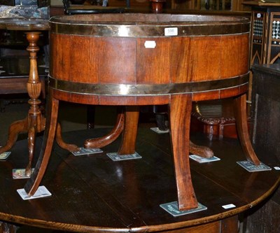 Lot 598 - Brass and oak planter with inner tray