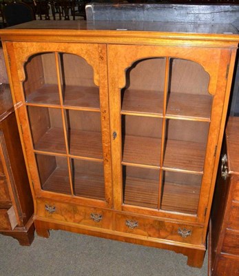 Lot 602 - A reproduction walnut glazed bookcase