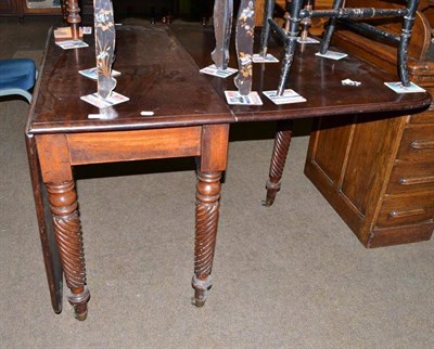 Lot 610 - A Regency drop leaf dining table on rope twist fly legs