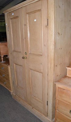 Lot 618 - A pine two door wardrobe