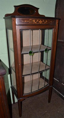 Lot 621 - An Edwardian mahogany display cabinet with leaded glass door