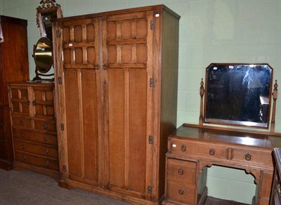 Lot 623 - An oak three piece bedroom suite with panel style doors