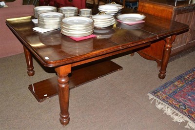 Lot 628 - A mahogany extending dining table with two leaves