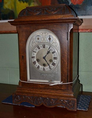 Lot 633 - An oak cased bracket clock