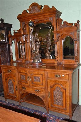 Lot 634 - A late Victorian walnut carved mirror back sideboard