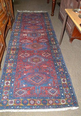 Lot 637 - Red and blue Eastern patterned runner