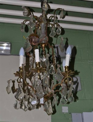 Lot 644 - A brass mounted chandelier with cut glass drops