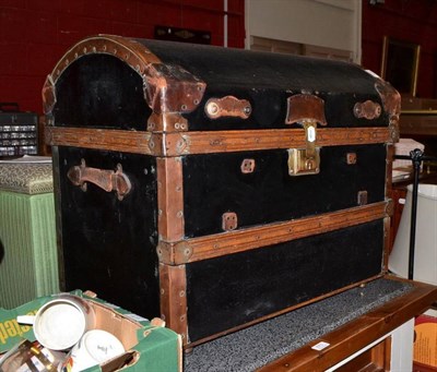 Lot 674 - A leather mounted and copper bound domed trunk