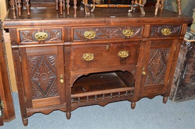 Lot 700 - A late Victorian carved walnut sideboard