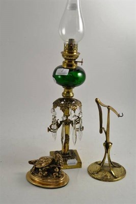 Lot 7 - A brass oil lamp with green glass font, a bronzed metal model of a partridge and another stand (3)