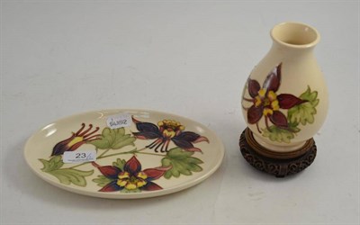 Lot 23 - A Moorcroft vase and a shallow dish, 23cm wide