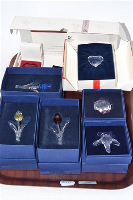 Lot 29 - Eight boxed Swarovski Crystal ornaments: red heart, blue heart, clear heart, starfish, shell,...