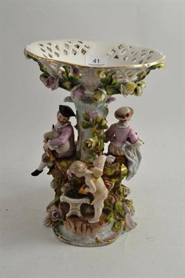 Lot 41 - A Sitzendorf lattice pierced and flower encrusted porcelain centrepiece on a figural base...