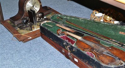 Lot 55 - Two cased violins with bows, two framed prints, oak mantel clock and a pair of ebony elephant...