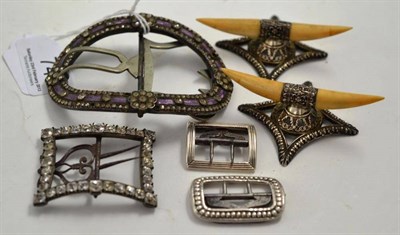 Lot 74 - Pair knife rests, Georgian and later buckles, etc