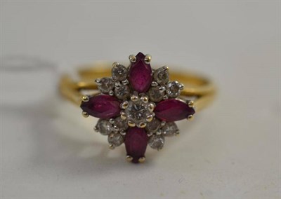 Lot 100 - An 18ct gold ruby and diamond cluster ring