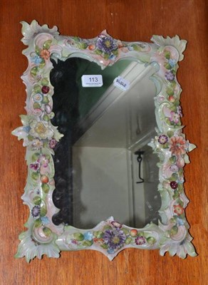 Lot 113 - A Continental flower encrusted porcelain framed wall mirror, 43cm by 33cm