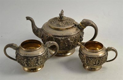 Lot 134 - An Indian white metal three piece tea service