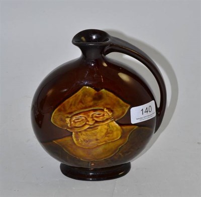 Lot 140 - A Royal Doulton Kingsware Dewars Whisky flagon decorated with a sailor (a.f.)