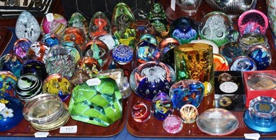 Lot 157 - A collection of fifty seven paperweights including millefiori, fruit and abstract forms (on two...