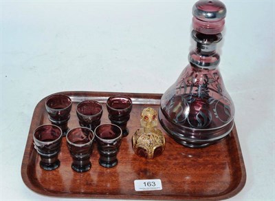 Lot 163 - An amethyst and silvered metal spirit set and a scent bottle