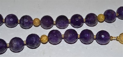 Lot 219 - A faceted amethyst bead necklace with gilt metal spacers and magnetic clasp