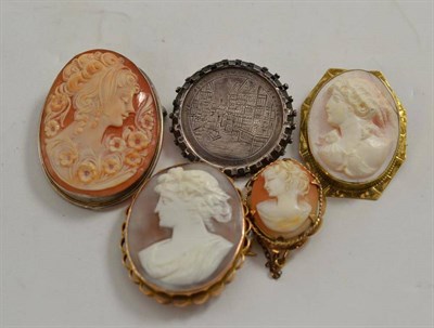 Lot 222 - Four cameo brooches and a silver brooch