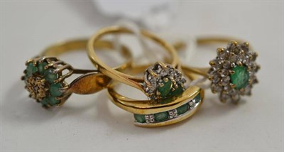 Lot 224 - Three 9ct gold emerald set rings and another, in silver gilt