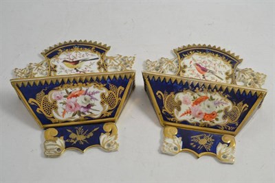 Lot 257 - A pair of porcelain wall pockets